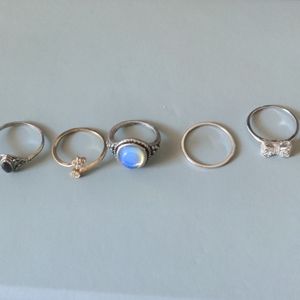 Dainty costume jewelry. 5 rings, thin and small.